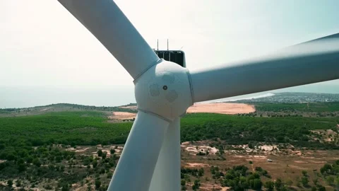 Close up large wind turbine with blades view bright orange blue sky sun in Stock Footage 237119692