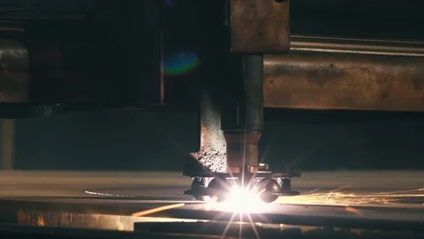 Close-up Laser Cutting Machine Cuts A Sheet Of Metal Stock Footage 105380347
