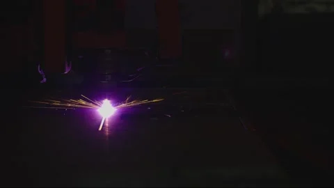 Close Up of Laser Cutting Machine Emitting Bright Sparks Stock Footage 296507257