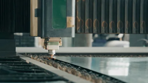 Close up of laser cutting machine incising metal sheet with sparks in workshop Stock Footage 340607551