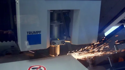 Close up of laser printer printing into steel plate in slow motion, Portugal Stock Footage 129066828