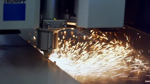 Close up of laser printer printing into steel plate in slow motion, Portugal Stock Footage 129067115