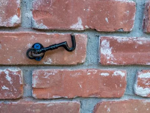 Close up of latch on brick wall Stock Photos