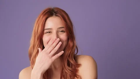 Close-up, laughing girl looking at camera on purple background Stock Footage 269154684