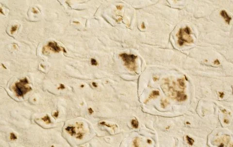 Close-up of lavash texture showing bubbles and charred spots Stock Photos