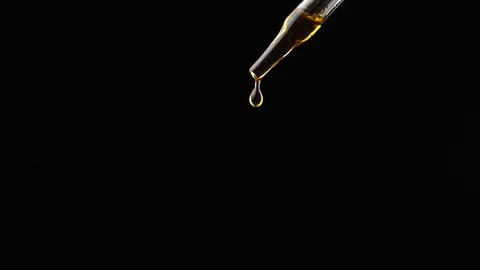 Close-up of lavender oil drops falling from the pipette Stock Footage 110910133