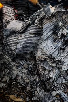 Close-up of layered ash and charred paper fragments showing detailed combustion Stock Photos