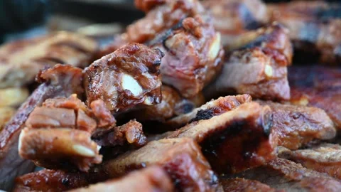 Close Up of Layered Roasted Pork Ribs Served on a Plate Stock Footage 341155508