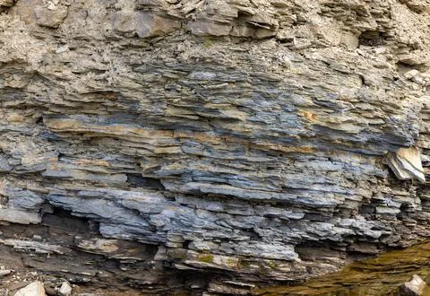 Close-up of layered sedimentary rocks, which are in coastal cliff formations Stock Photos