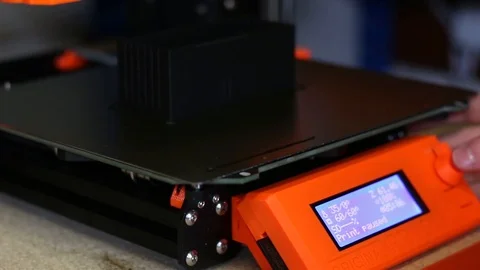 Close up of an LCD Screen on a 3D Printer - a hand interacts with a toggle and Stock Footage 93240132