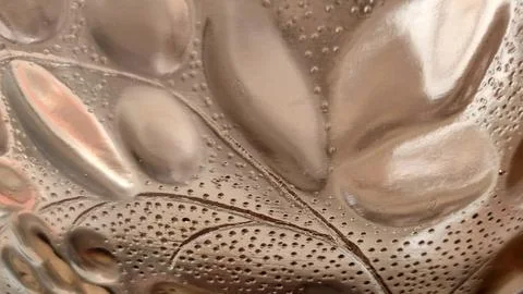 Close up of leaf pattern on textured brown glass Stock Photos