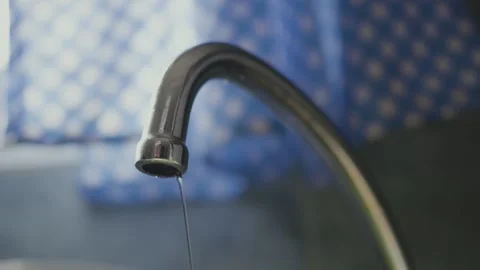 Close up of leaking kitchen faucet with dripping water Stock Footage 314065576