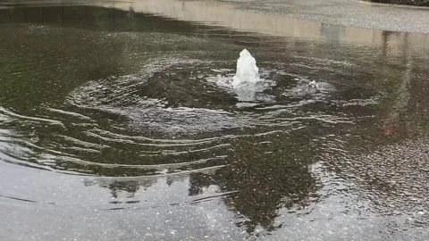Close-up of leaking water supply system in the city on the road. Stock Footage 244033913