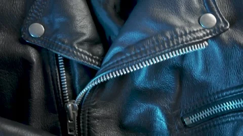 Close-Up of Leather Jacket in Changing Blue Light Vídeo Stock 301346915