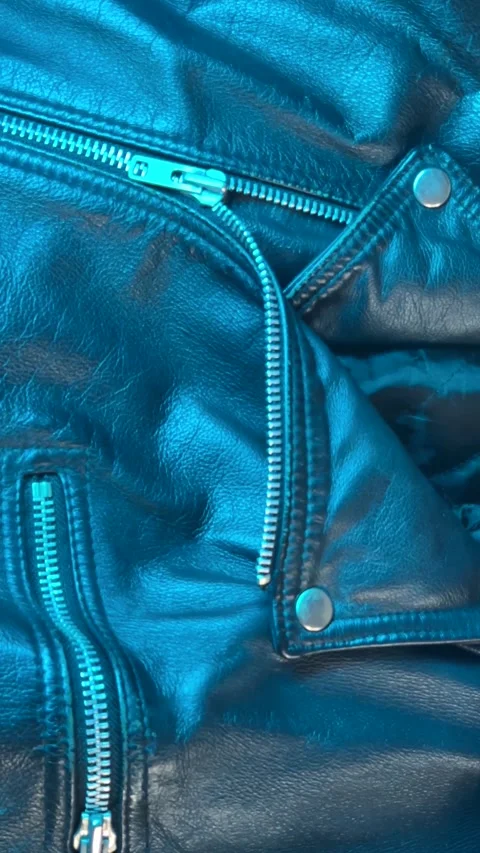 Close-Up of Leather Jacket in Changing Blue Light Stock Footage 301346930