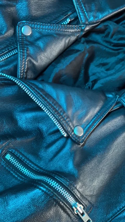 Close-Up of Leather Jacket in Changing Blue Light Stock Footage 301346940