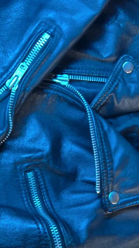 Close-Up of Leather Jacket in Changing Blue Light Stock Footage 301346941