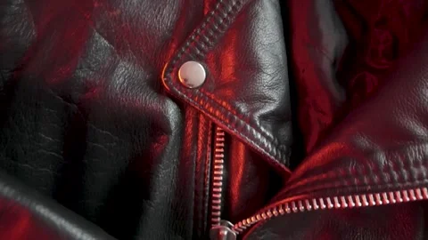 Close-up of a Leather Jacket in Shifting Red Light Vídeo Stock 301188181