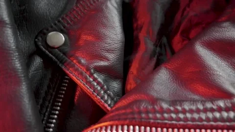 Close-up of a Leather Jacket in Shifting Red Light Stock Footage 301188340