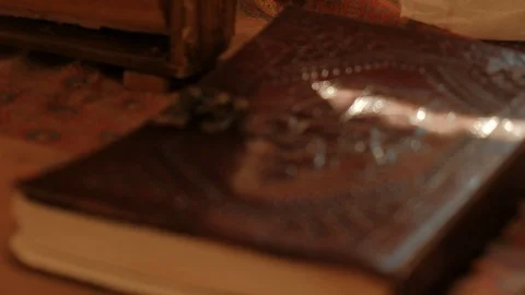 Close-up leather note book with pressed stamp of indian elephant god Ganesha Stock Footage 106449812