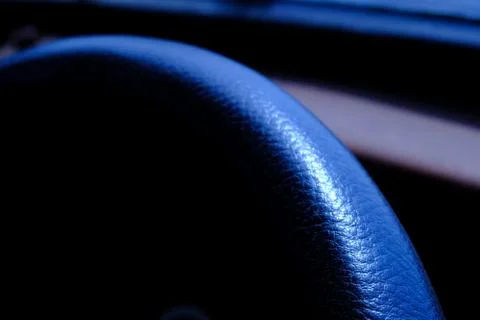 Close up leather texture car steer wheel with cold tone color Stock Photos