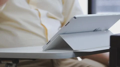 Close up of a lecturer using Tablet PC connected to a projector to teach class Stock-Footage 107613586