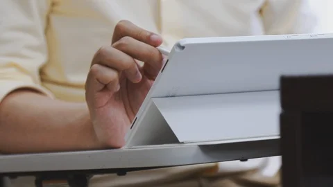 Close up of a lecturer using Tablet PC connected to a projector to teach class Stock Footage 107613797
