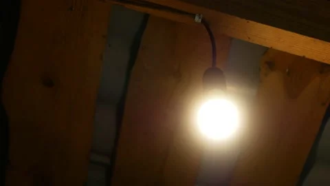 Close-up of the LED lamp turns on and then off Stock Footage 154870636