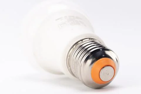 Close-up of an LED Light Bulb with Silver Base and White Background, Energy.. Stock Photos
