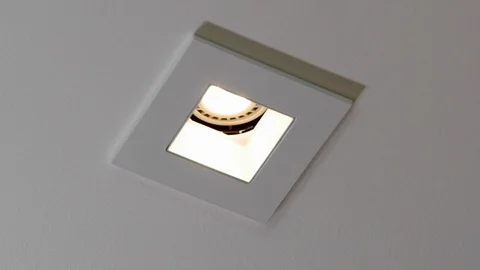 Close-up of LED light in home ceiling truning on. Stock Footage 98064851