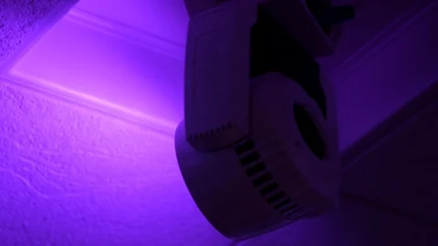 Close up of LED light spinning and shining purple light Stock Footage 107949933