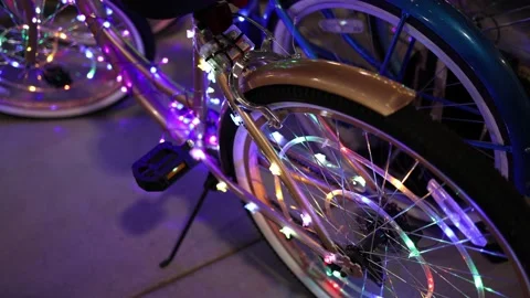 Close Up of Led Lights on Rear Wheel of Bicycle at McFadden Plaza - Shallow DOF Video stock 156031896