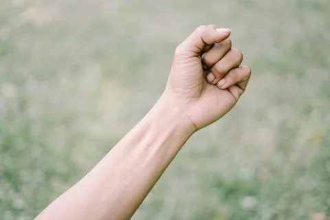 A close-up of a left hand in a gripping position, highlighting strength or .. Stock-Fotos