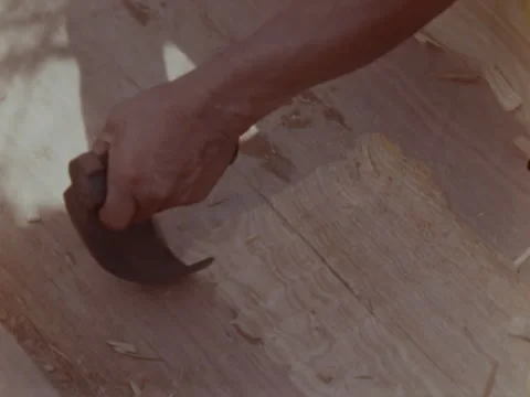 Close of left hand as Indian works to make a new pirogue. Stock Footage 147901320