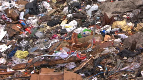 Close-up left pan of garbage in landfill Stock Footage 59544140