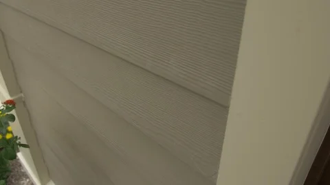 Close-up Left Pan of Tan Siding Stock Footage 100898724