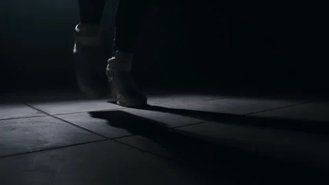 Close-up of a leg jumping rope in a dark room with back light  Stock Footage 274428949