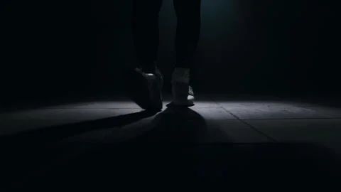 Close-up of a leg jumping rope in a dark room with back light  Stock-Footage 274428977