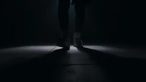 Close-up of a leg jumping rope in a dark room with back light  Stock-Footage 274428978