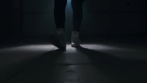 Close-up of a leg jumping rope in a dark room with back light  Stock-Footage 274429117