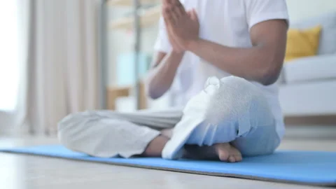 Close up of Legs of African Man doing Yoga at Home Stock Footage 154717554