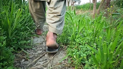 Close-up of the legs of a farmer man in exercises concept. Slow motion 1000fps Stock Footage 265537044