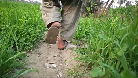 Close-up of the legs of a farmer man in exercises concept. Slow motion 1000fps Stock Footage 265537093