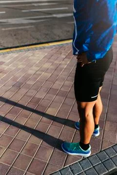 Close up of legs of runner in the city. Stock Photos