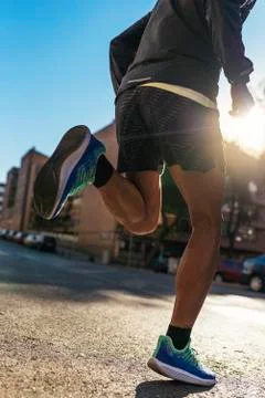 Close up of legs of runner in the city. Stock Photos