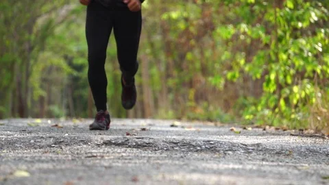 Close-up The legs of a runner, runners are jogging in the Park Video stock 107500558