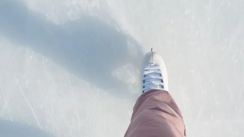 Close-up  legs on skates in winter on an open skating rink Stock Footage 259236846