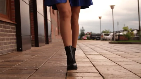 Close-up of the legs of a young woman walking around the city Stock Footage 94662053