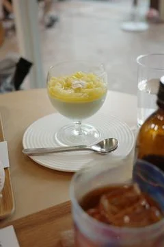 Close-up of lemon pudding in glass goblet Stock Photos