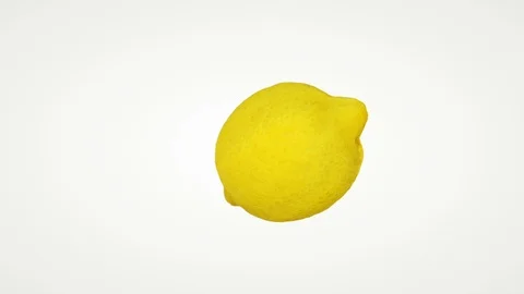 Close up of lemon rotating seamless loop against white Stock Footage 112121034